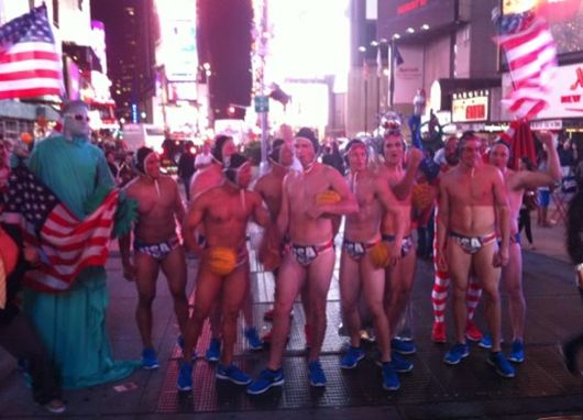 Miami Marlins rookies parade through Times Square dressed as the U.S. men's water polo team as part of "rookie hazing." (Twitter photo by Giancarlo Stanton)